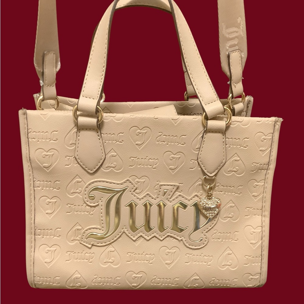 Juicy Couture Cream Embossed CrossbodyTote with heart bag charm. NEW!